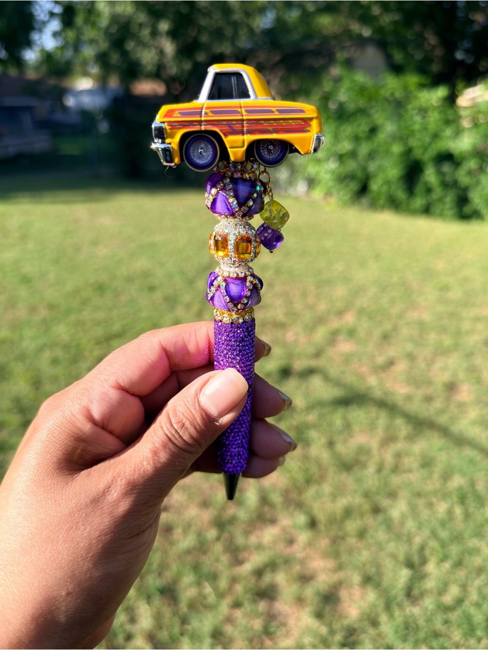 Lowrider 64 Impala Car Tuned Topper Pen with Purple and Yellow Accents.